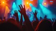 © buraratn - Silhouettes of unrecognizable people holding hands up and having fun during amazing music performance