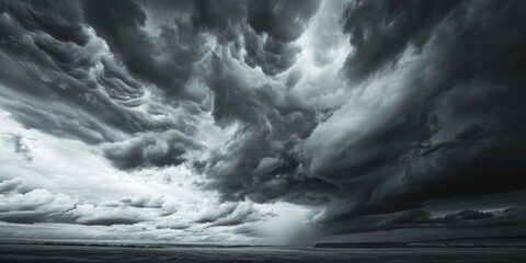 Wall Mural - a black and white photo capturing the beauty of a cloudy sky. suitable for various uses