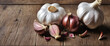 Garlic on wooden table, food background, copy space