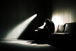 © Vid - silhouette of a desperate man in a dark room. Symbol of depression. AI generated.