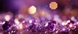Vibrant purple violet and gold glitter bokeh background with shining texture and sparkling elegance