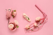 Composition with beautiful rose flowers and sex toys on pink background