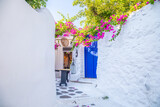 Fototapeta Uliczki - View of whitewashed cobbled street, Little Venice of Mykonos . Greek Island.