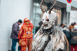 Carnival processions in Germany.Carnival costumes and characters. Krampus monster costumes on street background.Winter costume processions on the streets of Europe.Traditional cultural folklore