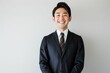 © Maki_Japan - 正面の笑顔の日本人の男性ビジネスマンのポートレート写真（白背景・サラリーマン・スーツ・若手・新人・新入社員）