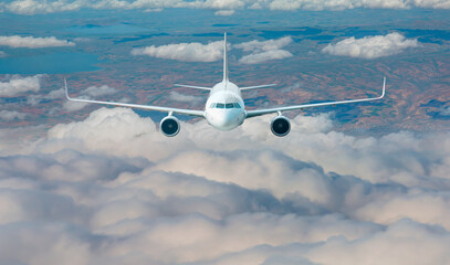 Wall Mural - Passenger airplane in the clouds - travel by air transport 