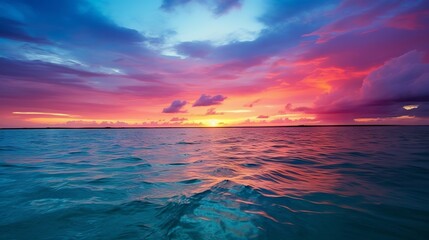 Wall Mural - beautiful sunset colors over the ocean with fluffy clouds