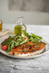 Wall Mural - Portion of gourmet grilled salmon steak with vegetables