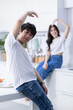 © Thinapob - Happy portrait of cheerful young loving couple asian of having fun heart-shaped hand gesture standing a cheerful preparing food and enjoy cook cooking while standing on a kitchen Condo life or home