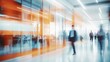 © Ashi - Abstract blurred business environment with blue and orange hues: dynamic white glass office interior with corporate professionals