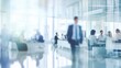 © Ashi - Dynamic corporate atmosphere: blurred business professionals in modern glass office setting