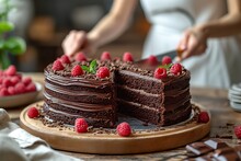 Woman Cuts Chocolate Cake With A Knife In A Modern Light Kitchen