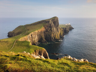 Poster - A view of the Neist Point Lighthouse on the green cliffs of the Isle of Skye