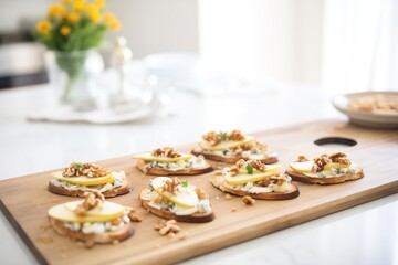 Wall Mural - pear, walnut, and gorgonzola bruschettas on a tray