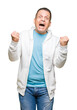 © Krakenimages.com - Middle age arab man wearing sweatshirt over isolated background celebrating surprised and amazed for success with arms raised and open eyes. Winner concept.