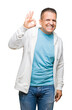 © Krakenimages.com - Middle age arab man wearing sweatshirt over isolated background smiling positive doing ok sign with hand and fingers. Successful expression.