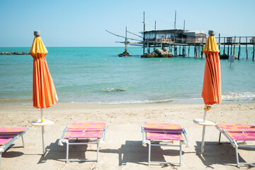 Scenic view of parasol and lounge chair at the beach