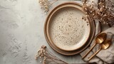Fototapeta  - Explore the chic aesthetic of a beige porcelain plate on a pastel background, complemented by golden cutlery and dried flowers--a perfect dishware mockup. ar 16:9