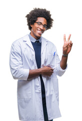 Wall Mural - afro american doctor scientist man over isolated background smiling with happy face winking at the c