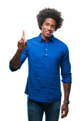 Sticker - Afro american man over isolated background showing and pointing up with finger number one while smiling confident and happy.