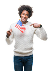 Poster - Afro american man flag of United States of America over isolated background with surprise face pointing finger to himself