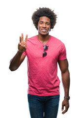 Poster - Afro american man over isolated background showing and pointing up with fingers number three while smiling confident and happy.