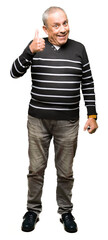 Sticker - Handsome senior man wearing winter stripes sweater doing happy thumbs up gesture with hand. Approving expression looking at the camera with showing success.