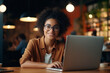 Smiling Portrait of a Beautiful and Happy Professional Using Laptop - Banner of Technology, Cyber Connectivity, and Positive Entrepreneurial Lifestyle, Young African American Businesswoman