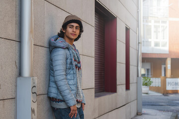 Wall Mural - urban young man posing on street wall