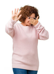 Poster - Beautiful middle ager senior woman wearing pink sweater and sunglasses over isolated background covering eyes with hands and doing stop gesture with sad and fear expression. Embarrassed and negative.