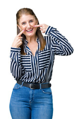 Poster - Middle age mature business woman over isolated background smiling confident showing and pointing with fingers teeth and mouth. Health concept.