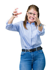 Sticker - Beautiful middle age mature business woman wearing glasses over isolated background Shouting frustrated with rage, hands trying to strangle, yelling mad