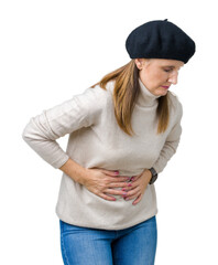 Canvas Print - Middle age mature woman wearing winter sweater and beret over isolated background with hand on stomach because indigestion, painful illness feeling unwell. Ache concept.