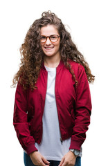 Sticker - Beautiful brunette curly hair young girl wearing jacket and glasses over isolated background with a happy and cool smile on face. Lucky person.