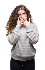 Sticker - Beautiful brunette curly hair young girl wearing winter sweater over isolated background shocked covering mouth with hands for mistake. Secret concept.