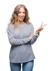 Sticker - Beautiful young blonde woman wearing stripes sweater over isolated background smiling with happy face winking at the camera doing victory sign. Number two.