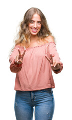 Poster - Beautiful young blonde woman over isolated background smiling looking to the camera showing fingers doing victory sign. Number two.