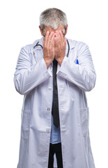 Wall Mural - Handsome senior doctor man over isolated background with sad expression covering face with hands while crying. Depression concept.