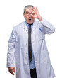 Handsome senior doctor, scientist professional man wearing white coat over isolated background doing ok gesture shocked with surprised face, eye looking through fingers. Unbelieving expression.