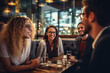 © InnovPixel - A group of friends hanging out in a cafe, or a restaurant, talking and laughing happily, enjoying their time together.