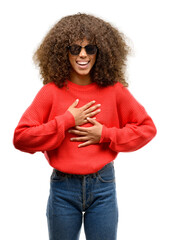 Poster - African american woman wearing sunglasses confident and happy with a big natural smile laughing