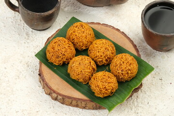 Wall Mural - Kremes Ubi or kue cakar ayam is Sweet Potatoes Crunchy Cake made from Grated Sweet Potatoes and Sugar. Indonesian Traditional Snack