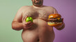 An overweight person decides to eat a apple or a burger. 