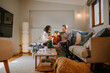 © Austockphoto - Family with young boy together on couch at home