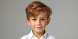 © piai - A 5 year old cheerful boy in a white school uniform, passport photography