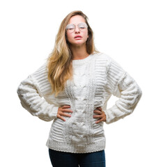 Sticker - Young beautiful blonde woman wearing winter sweater and sunglasses over isolated background winking looking at the camera with sexy expression, cheerful and happy face.