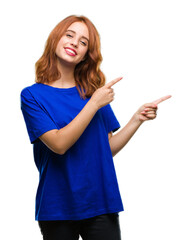 Sticker - Young beautiful woman over isolated background smiling and looking at the camera pointing with two hands and fingers to the side.