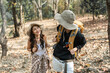 © itchaznong - Happy LGBT Lesbian couple Travelers Hiking with Backpacks in forest Trail. LGBT Lesbian Couple Hikers with backpacks walks in mountains in vacation