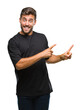 © Krakenimages.com - Young handsome man over isolated background smiling and looking at the camera pointing with two hands and fingers to the side.