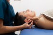 © ADDICTIVE STOCK - Chiropractor performing neck adjustment on patient